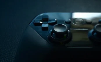 A focused codes etruesports view of a black and white video game controller, highlighting its unique features and style.