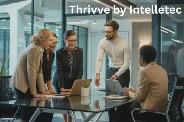 Business professionals collaborating in an office setting, representing Thrivve by Intelletec.